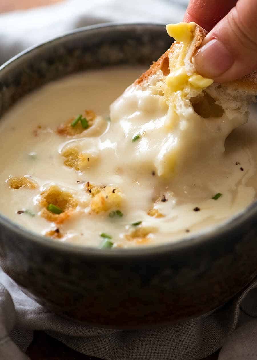 Dunking crusty warm bread into thick and creamy Leek Soup