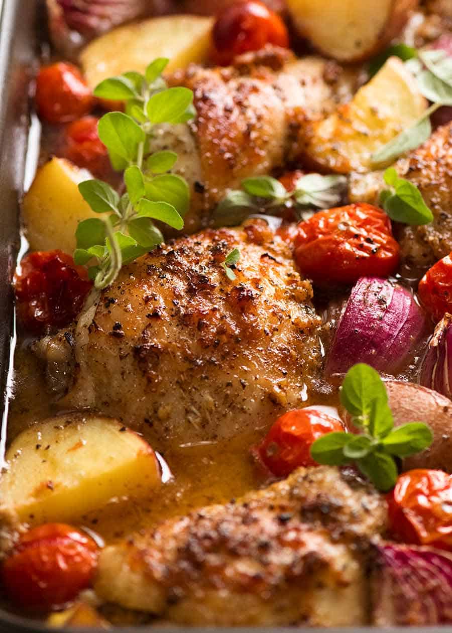 Mediterranean Baked Chicken Dinner in a pan, fresh out of the oven ready to be served