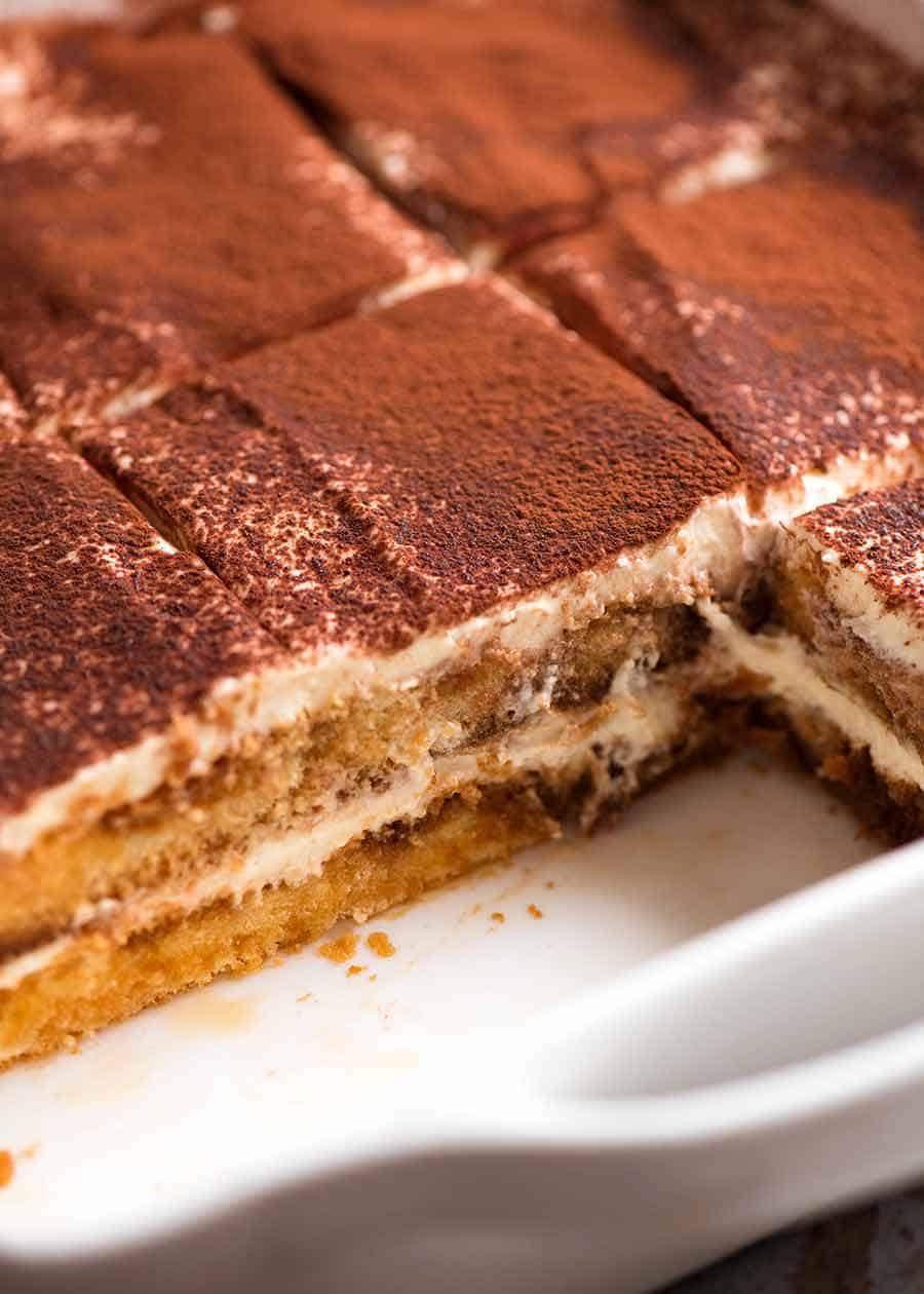 Close up of Tiramisu in a white dish, ready to be served