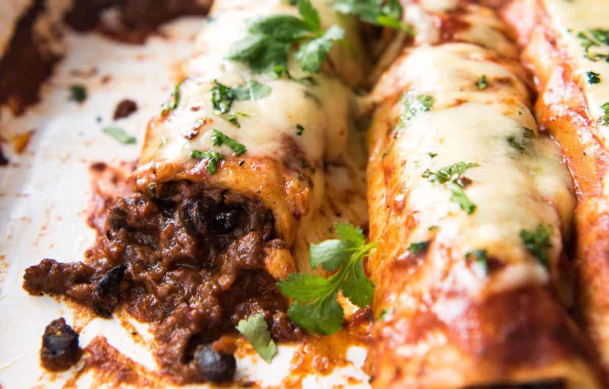 The BEST Beef Enchiladas, with an extra tasty, extra saucy filling and the most incredible homemade Enchilada Sauce! www.recipetineats.com