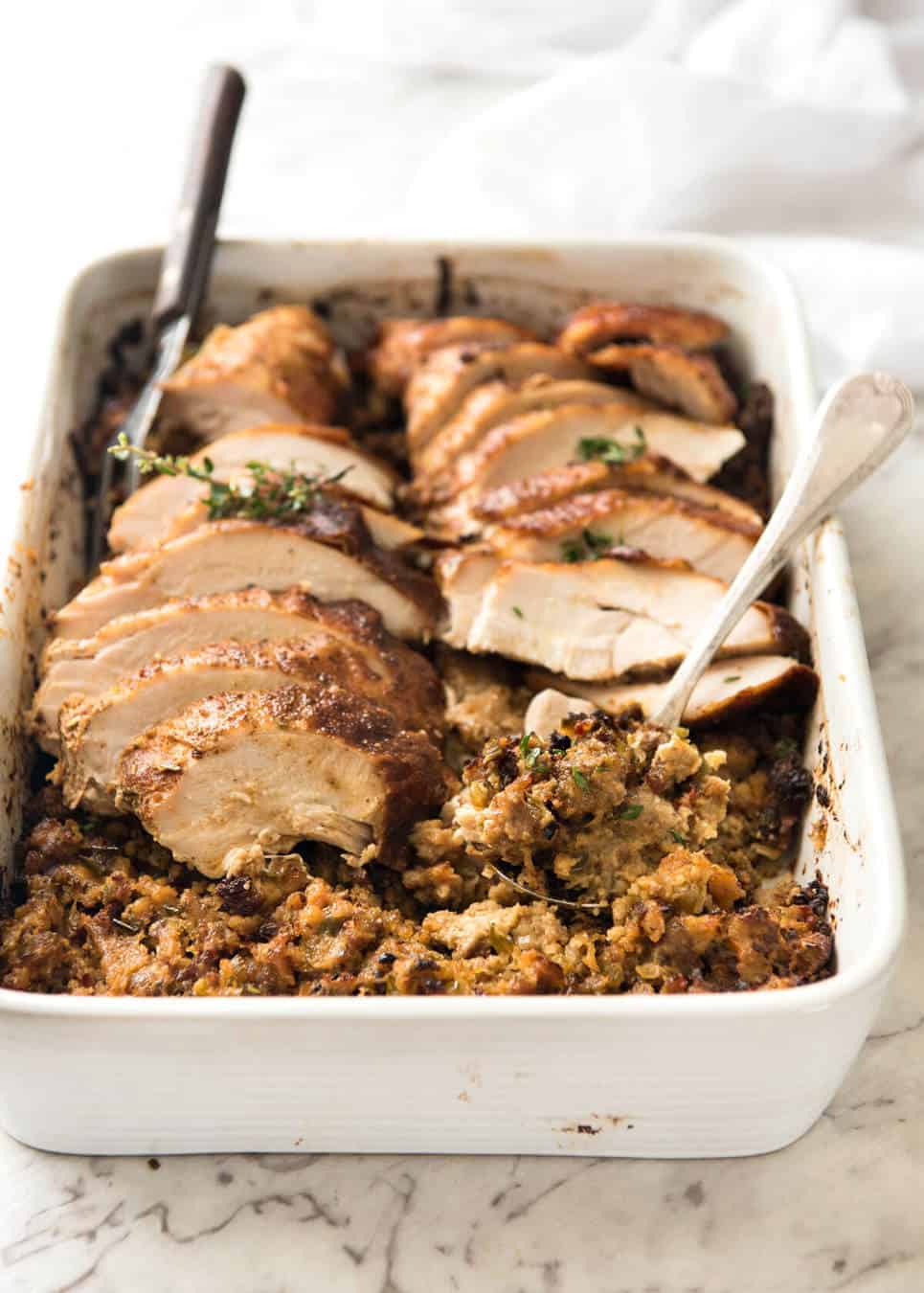 This Cajun dry brined turkey breast is baked in the same roasting pan as the Dressing / Stuffing so it's extra juicy and moist! A chef recipe, this Cajun Baked Turkey Breast with Dressing is easy and spectacular. EPIC ONE PAN COOKING for a Thanksgiving turkey! www.recipetineats.com