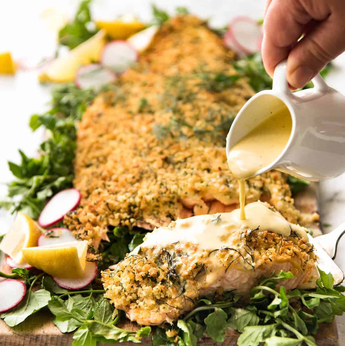 Baked Parmesan Crusted Salmon with Lemon Cream Sauce - easy and fast to make, can be prepared ahead, a stunning centrepiece for Christmas dinner and yet easy enough for midweek. That Lemon Cream sauce is the perfectly finishing tough. www.recipetineats.com