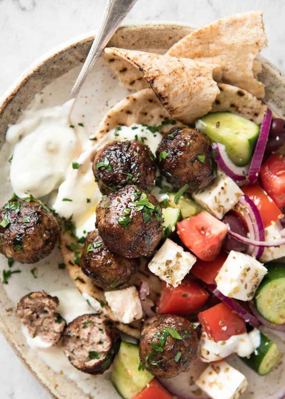 Soft, juicy, beautifully flavoured GREEK MEATBALLS! Serve as an appetiser with tzatziki, main with Greek Salad or make wraps! www.recipetineats.com