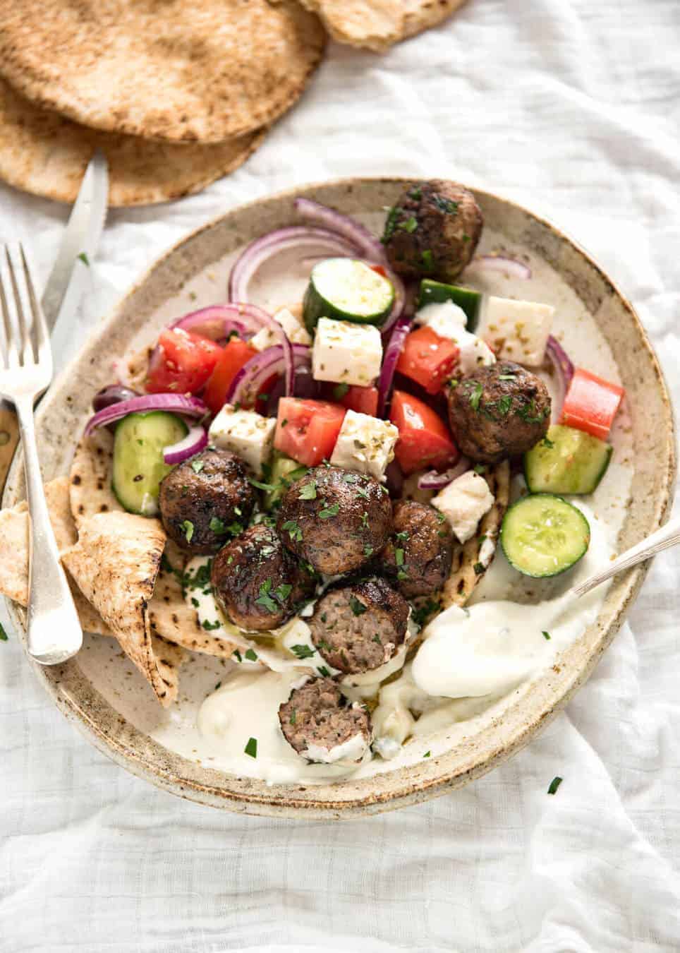 Soft, juicy, beautifully flavoured GREEK MEATBALLS! Serve as an appetiser with tzatziki, main with Greek Salad or make wraps! www.recipetineats.com