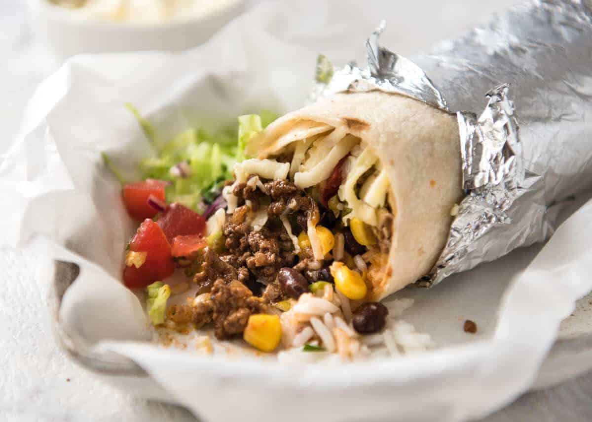 A great everyday Beef Burrito, made with super tasty seasoned beef filling. Fresh and freezable versions! www.recipetineats.com