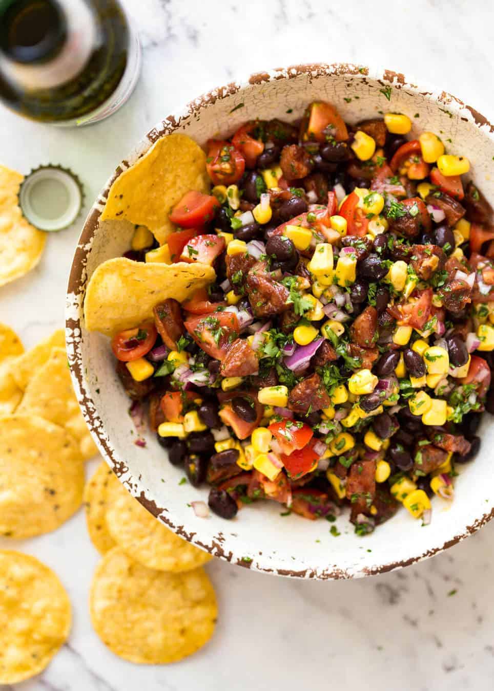 I call this a PIG OUT Salsa. Sensible people would call it an Chorizo, Black Bean and Corn Salsa. :) www.recipetineats.com