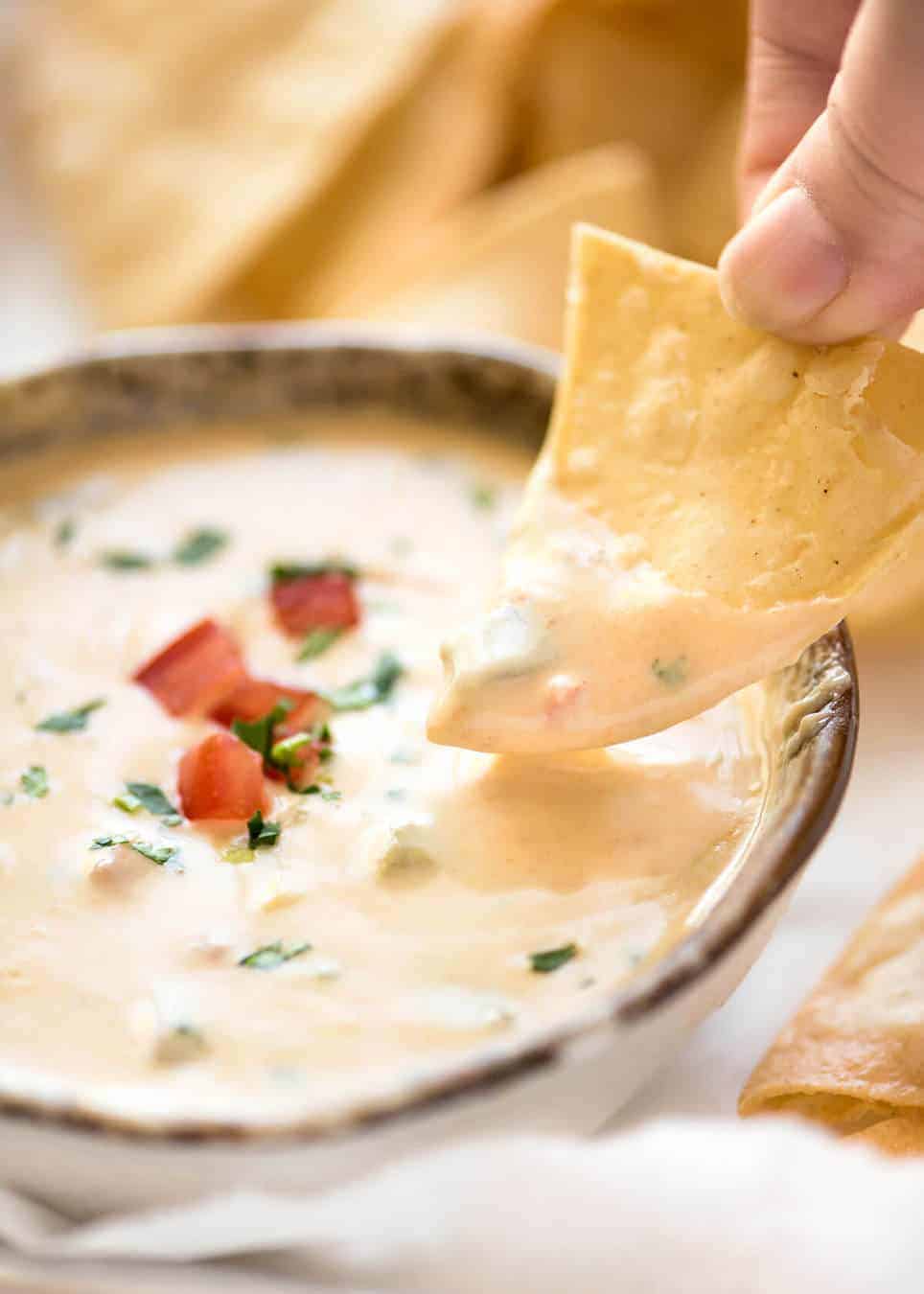 Code cracked: Queso Dip made with real cheese that's ultra silky even when it cools. www.recipetineats.com