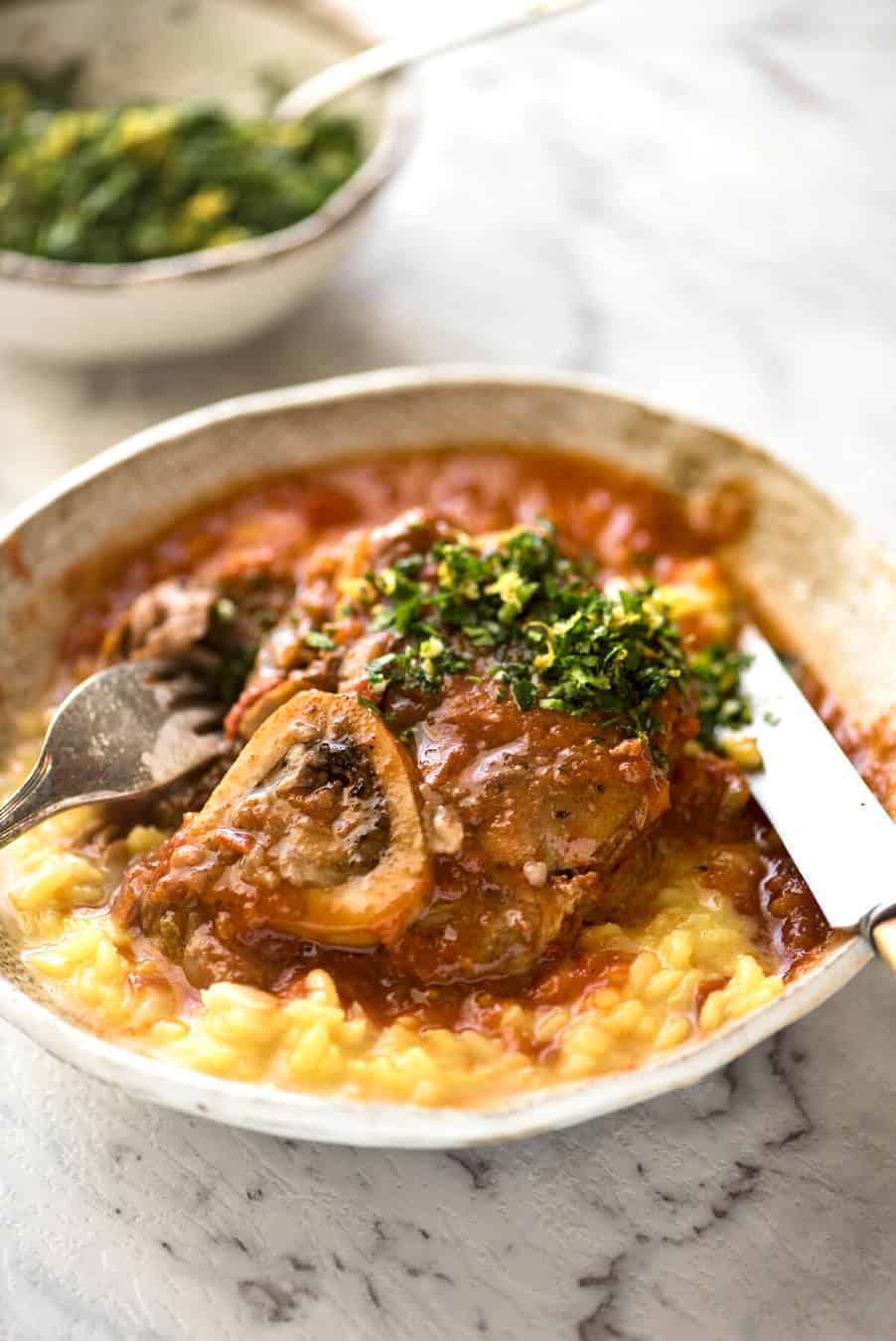 Fork tender veal braised in a rich red sauce, Osso Buco is a meal fit for a king! www.recipetineats.com