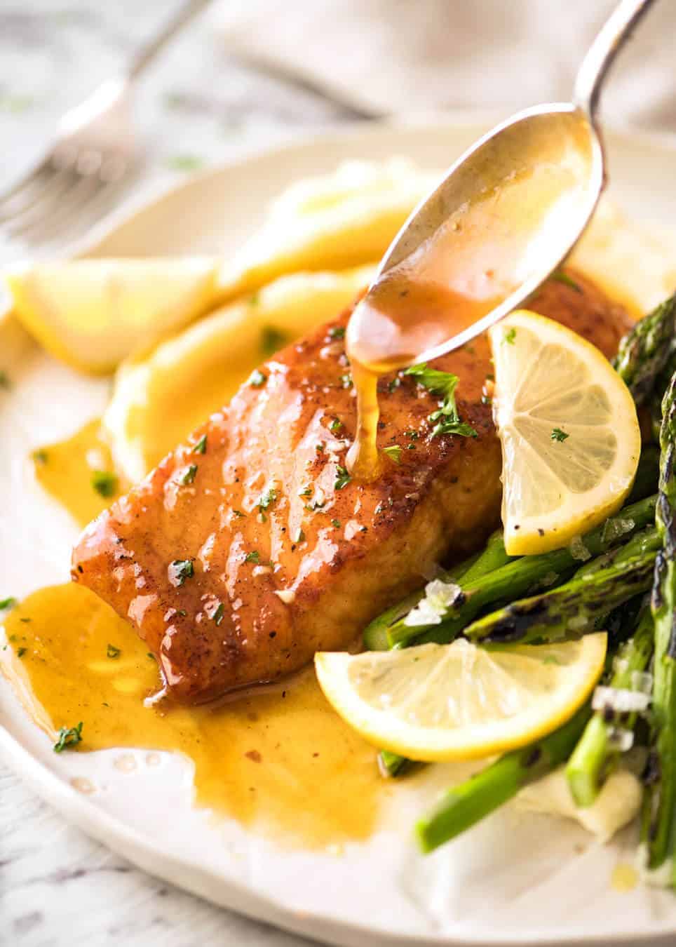If this Lemon Honey Glazed Salmon takes more than 8 minutes to make, you've overcooked the salmon. That sauce is lip smackingly delicious! www.recipetineats.com