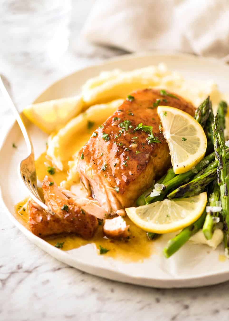 If this Lemon Honey Glazed Salmon takes more than 8 minutes to make, you've overcooked the salmon. That sauce is lip smackingly delicious! www.recipetineats.com
