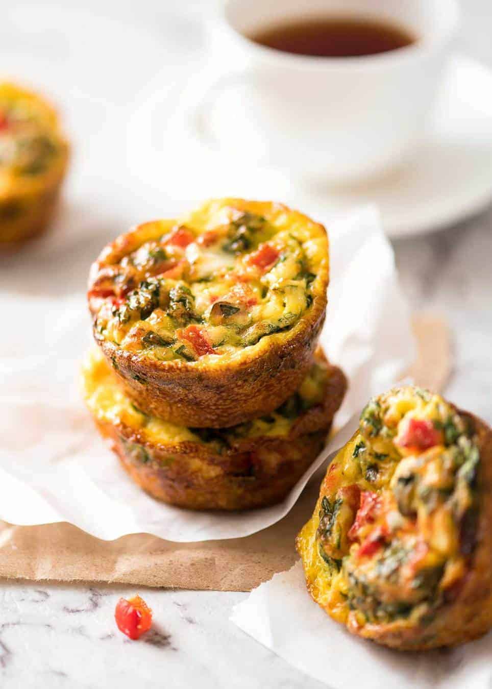 Healthy doesn't have to be bland! These Healthy Egg Muffins are a great grab & go breakfast option. Egg, spinach, feta, cherry tomatoes and bell peppers/capsicum. www.recipetineats.com