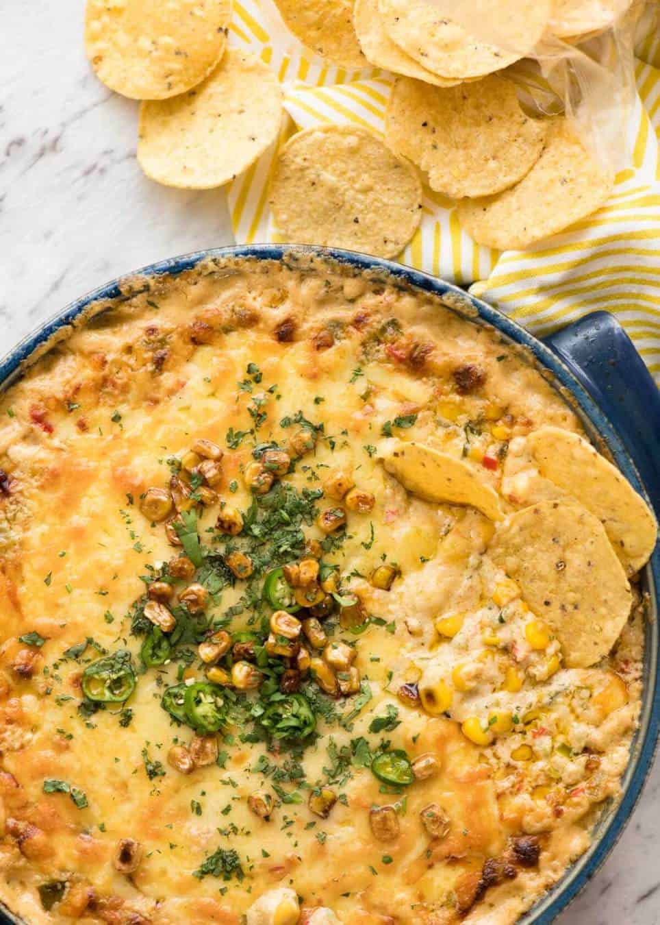 Essential Super Bowl food - a big batch Hot Corn Dip that's made for eating with eyes glued to the TV screen. 