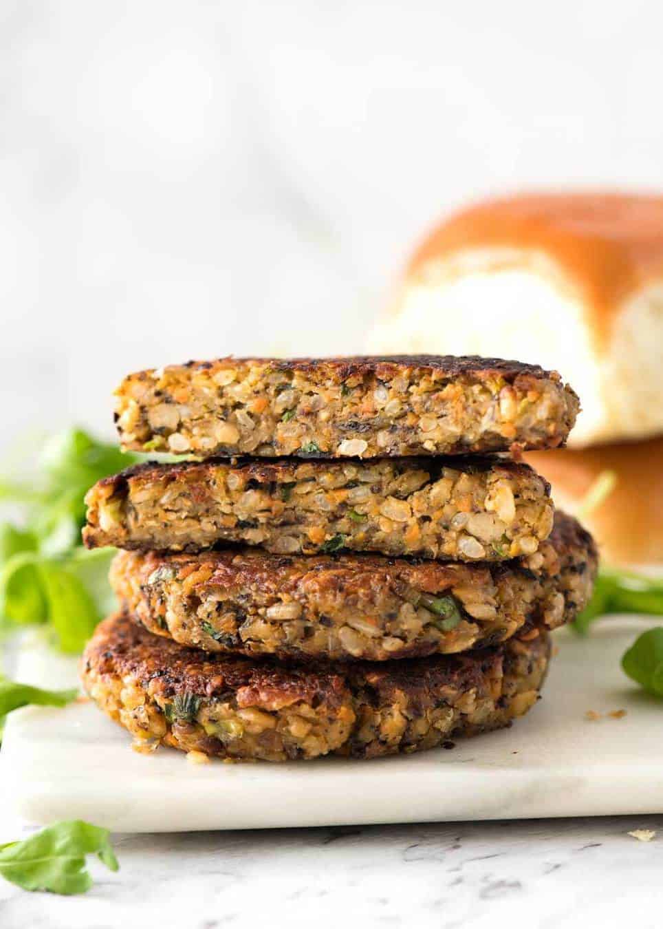 Stack of Veggie Burgers with one patty cut open to show the inside