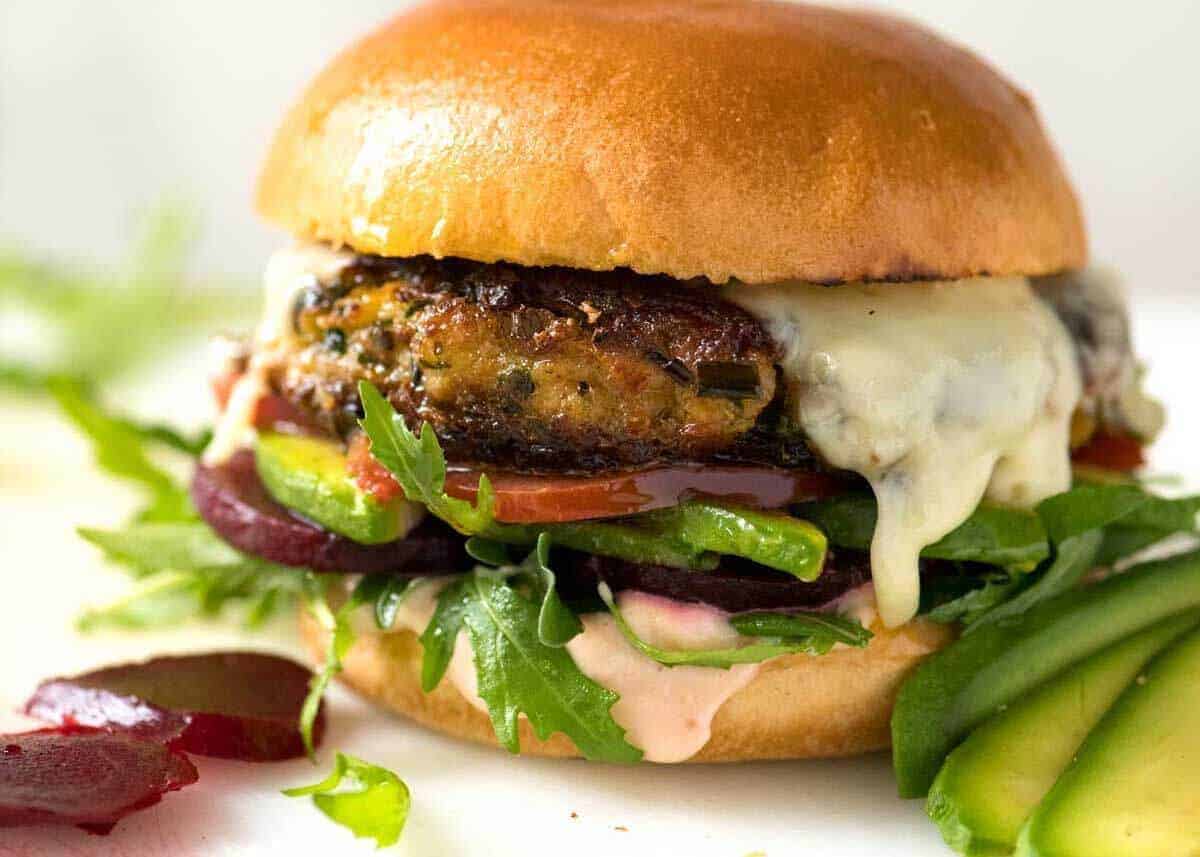 Veggie Burger with rocket, lettuce and tomato on a golden brioche bun