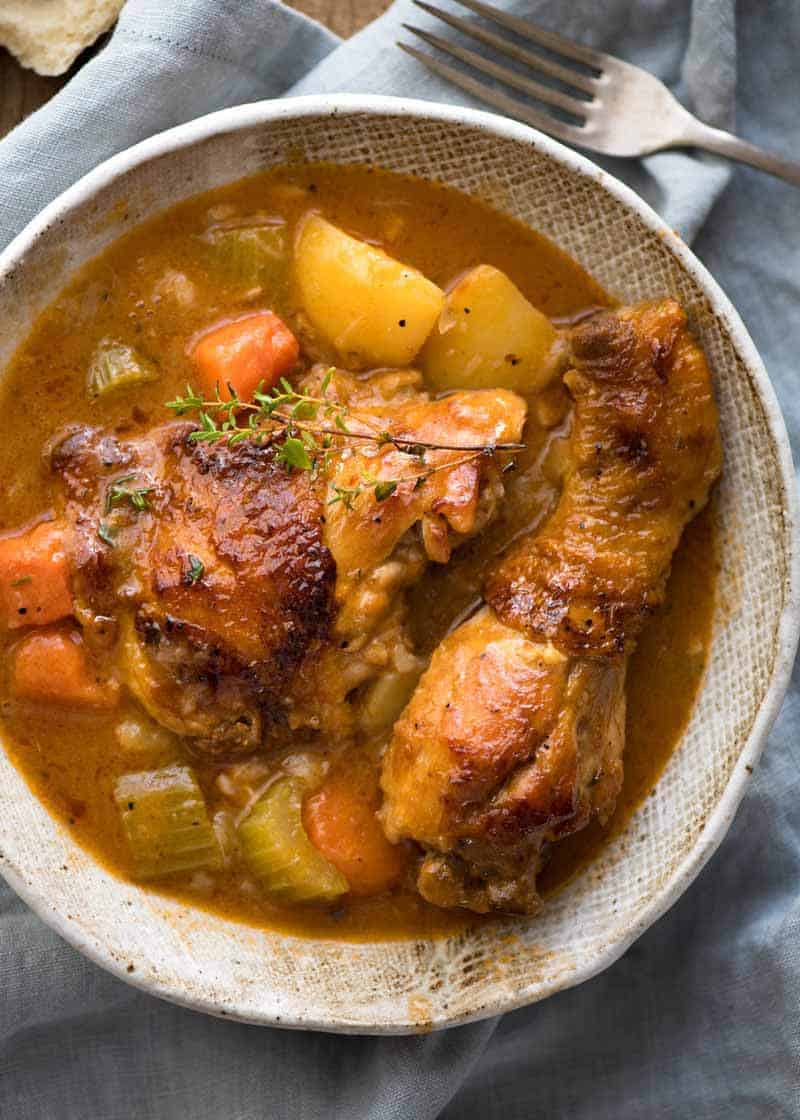 Chicken Stew in a rustic brown bowl, ready to be eaten