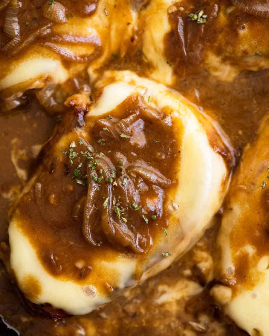 Overhead photo of French Onion Smothered Pork Chops in a skillet, fresh off the stove