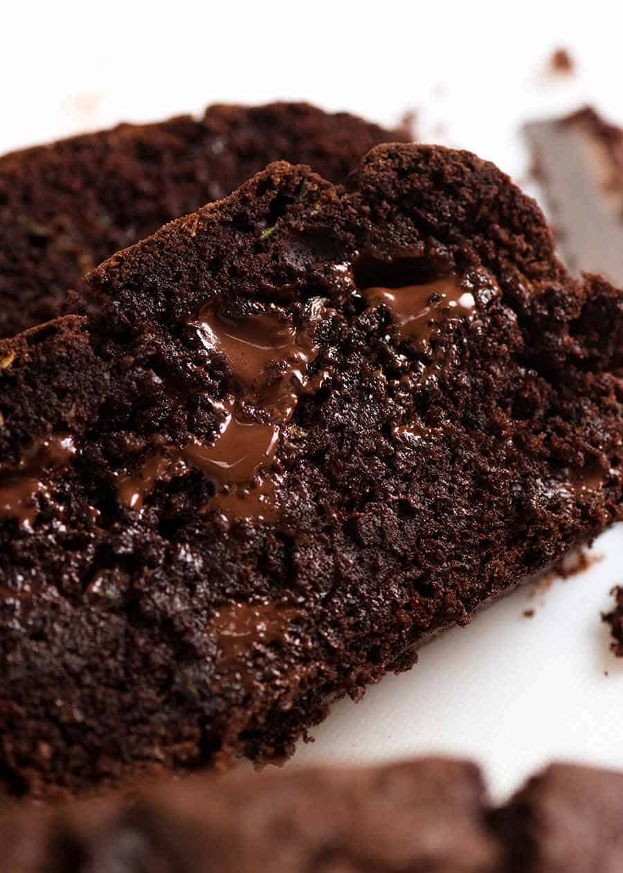 Close up of slice of the most amazing Chocolate Zucchini Bread with molten chocolate and fudgy insides!