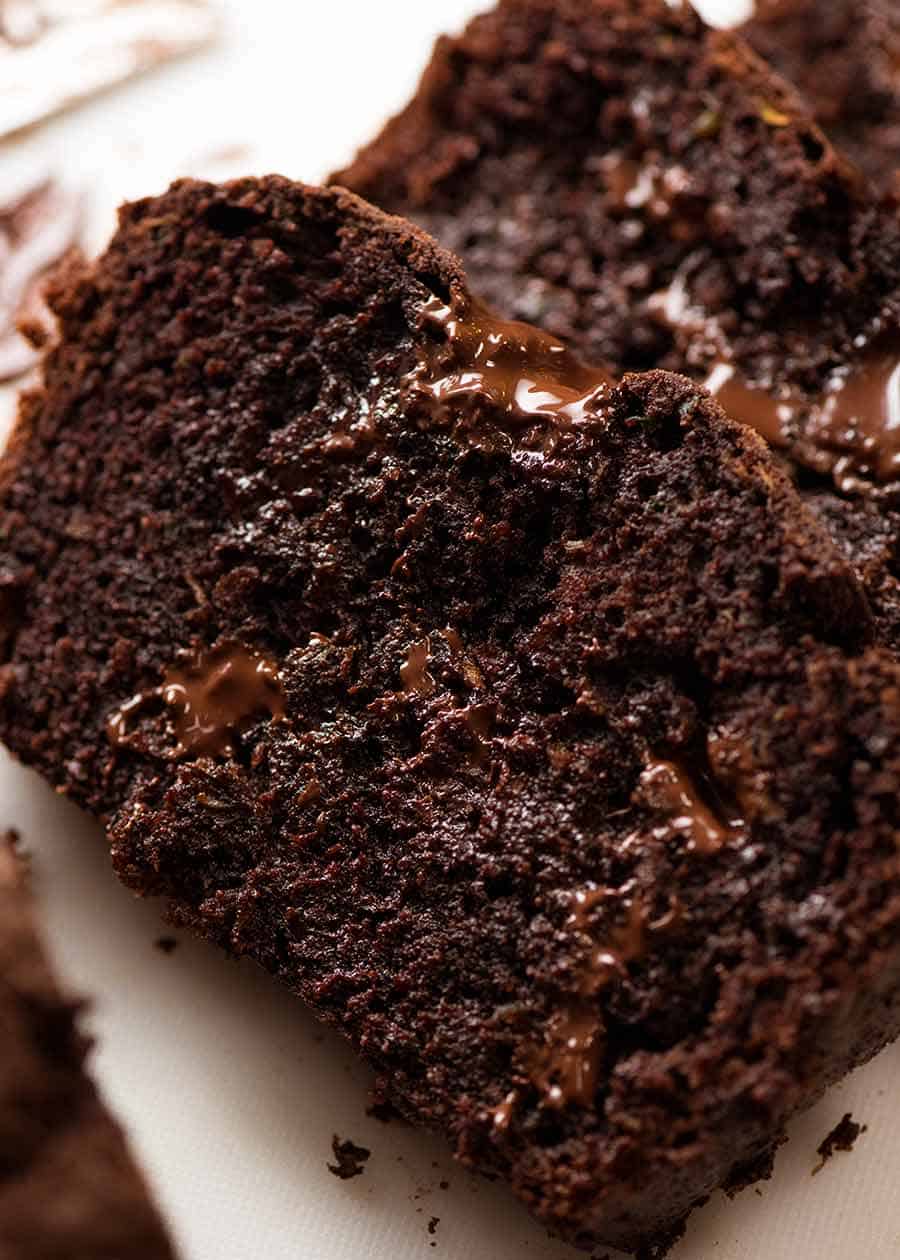 Close up photo of the best Chocolate Zucchini Bread with molten melty chocolate and fudgy insides!