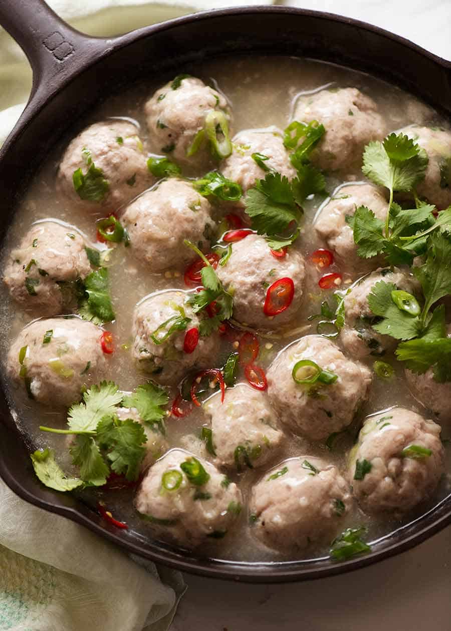 Overhead close up photo of Vietnamese Pork Meatballs for Banh Mi Vietnamese Sandwich in a black skillet