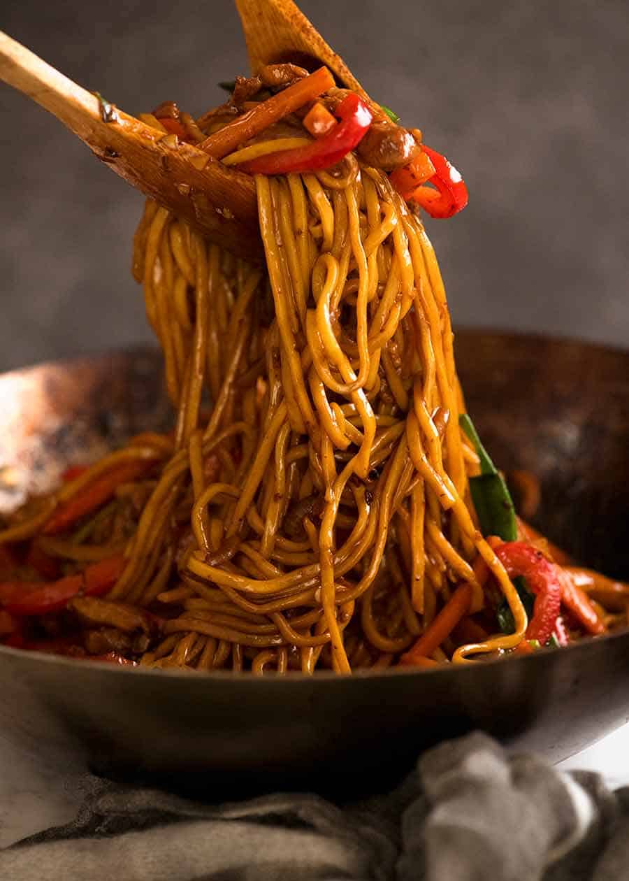 Tossing Lo Mein noodles in a wok